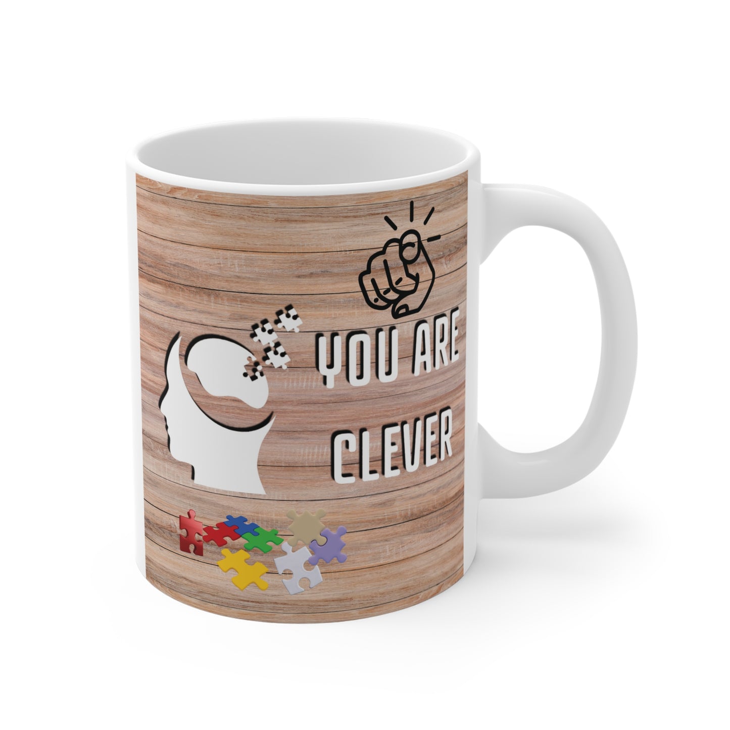 Motivational "You Are Clever" coffee mug. The design includes a human head silhouette with colorful jigsaw puzzle pieces, ideal as a gift for students, teachers, or puzzle lovers.