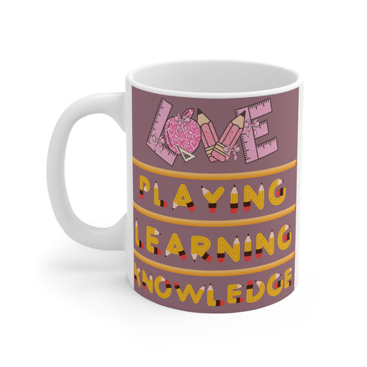 Shop our school-themed 11oz mug with pencil and ruler design of LOVE, PLAYING, LEARNING, and KNOWLEDGE. Ideal gift for teachers, students, and education lovers.