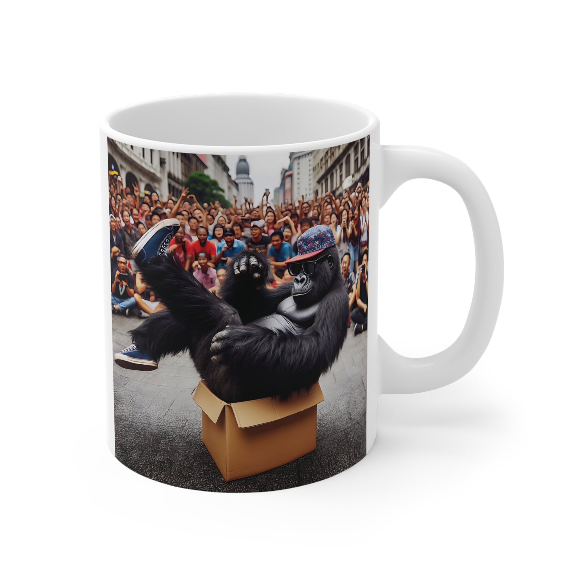 Funny gorilla coffee mug featuring a cool ape wearing sunglasses and a colorful cap while relaxing in a cardboard box in front of a cheering crowd.