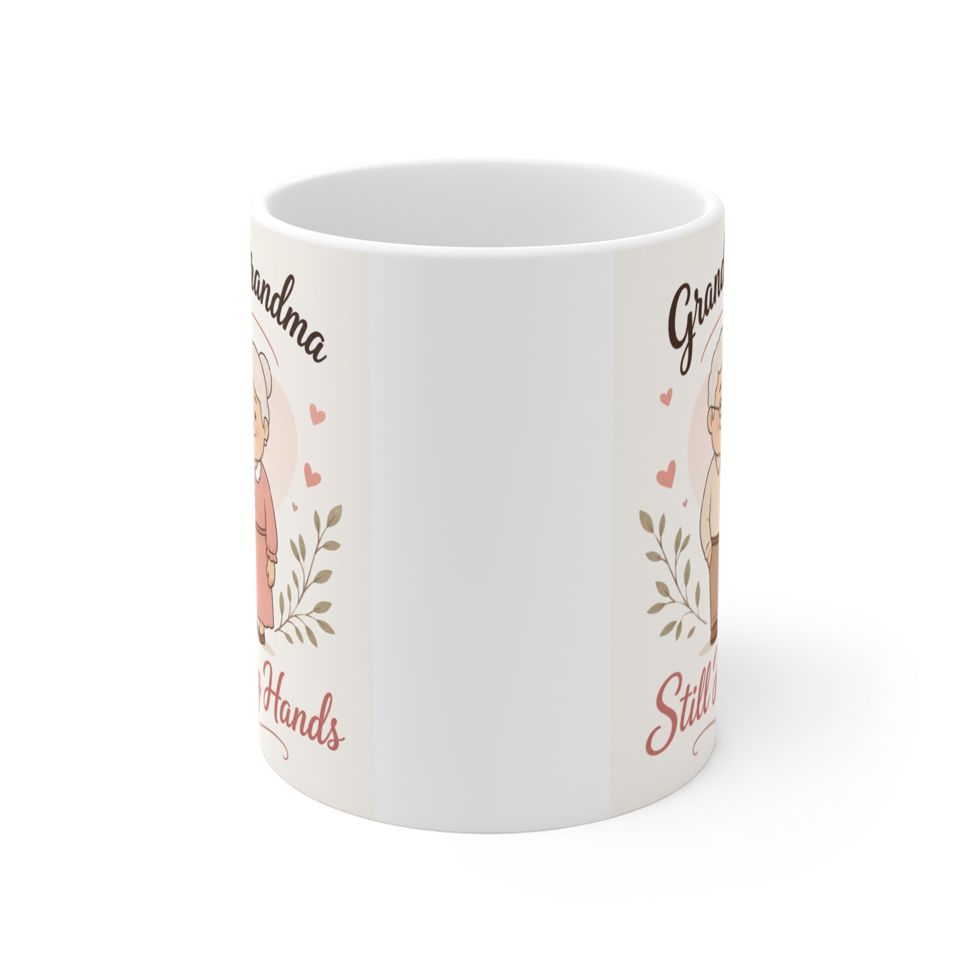 Sentimental grandparents coffee mug with an adorable elderly couple illustration, hearts, botanical accents, and the phrase "Still Holding Hands," perfect for anniversary and Grandparents Day gifts.