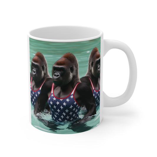 Gorilla swimming mug featuring strong apes in star-pattern swimsuits in water, unique animal-themed 11oz ceramic coffee mug