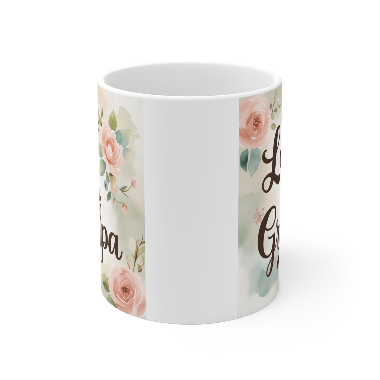 White ceramic mug with Love You Grandpa quote and soft pink floral design, thoughtful coffee cup gift for grandpa from grandchildren.