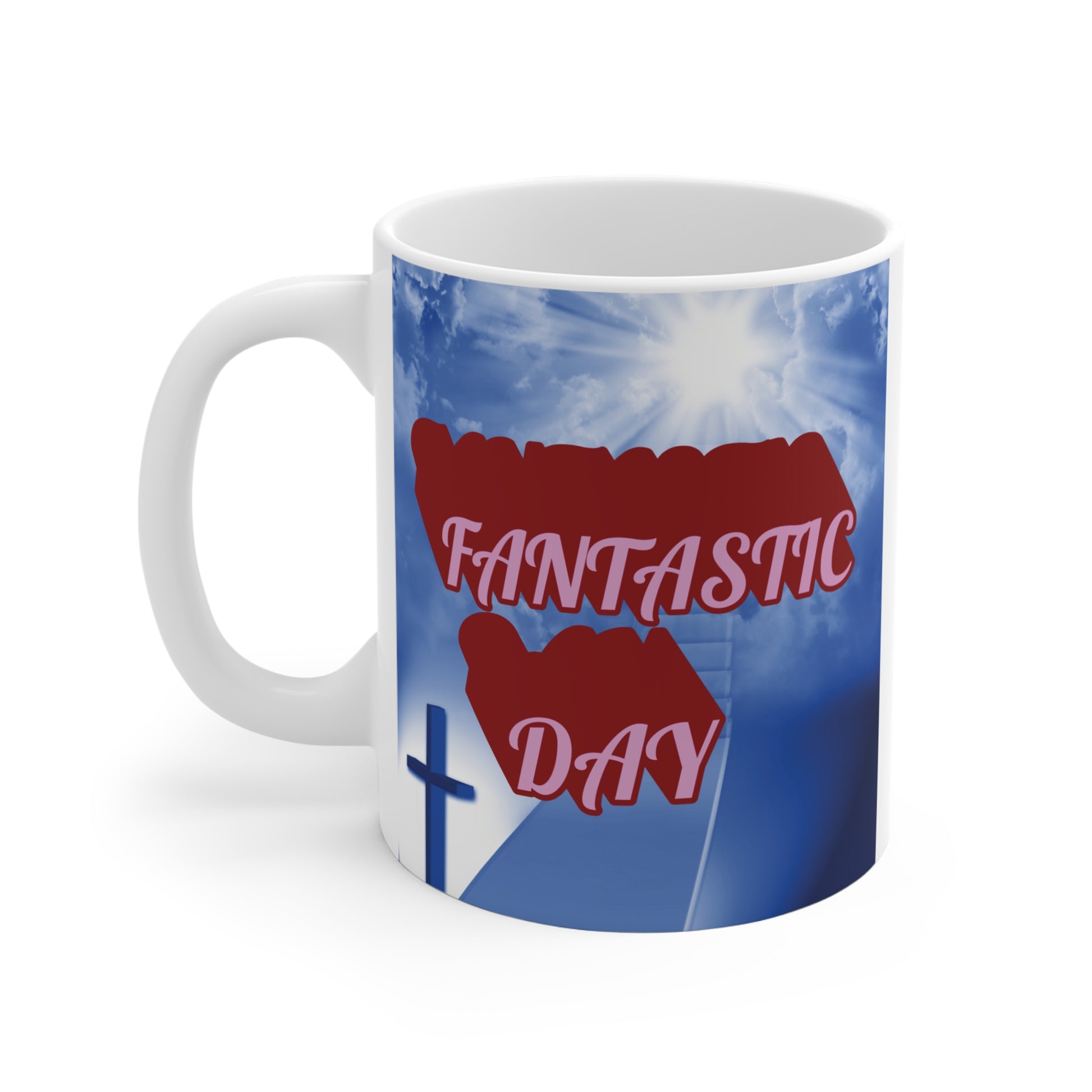 Faith-based coffee mug featuring cross silhouette, bright sky with sunlight, and positive ‘Fantastic Day’ quote