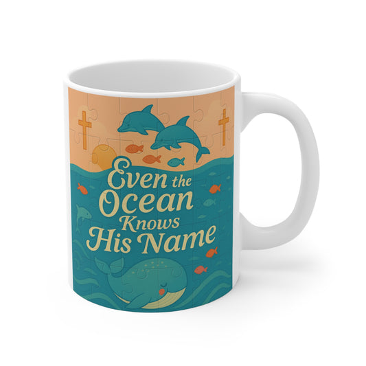11oz Christian dolphin coffee mug with “Even the Ocean Knows His Name” ocean quote and coastal blue design