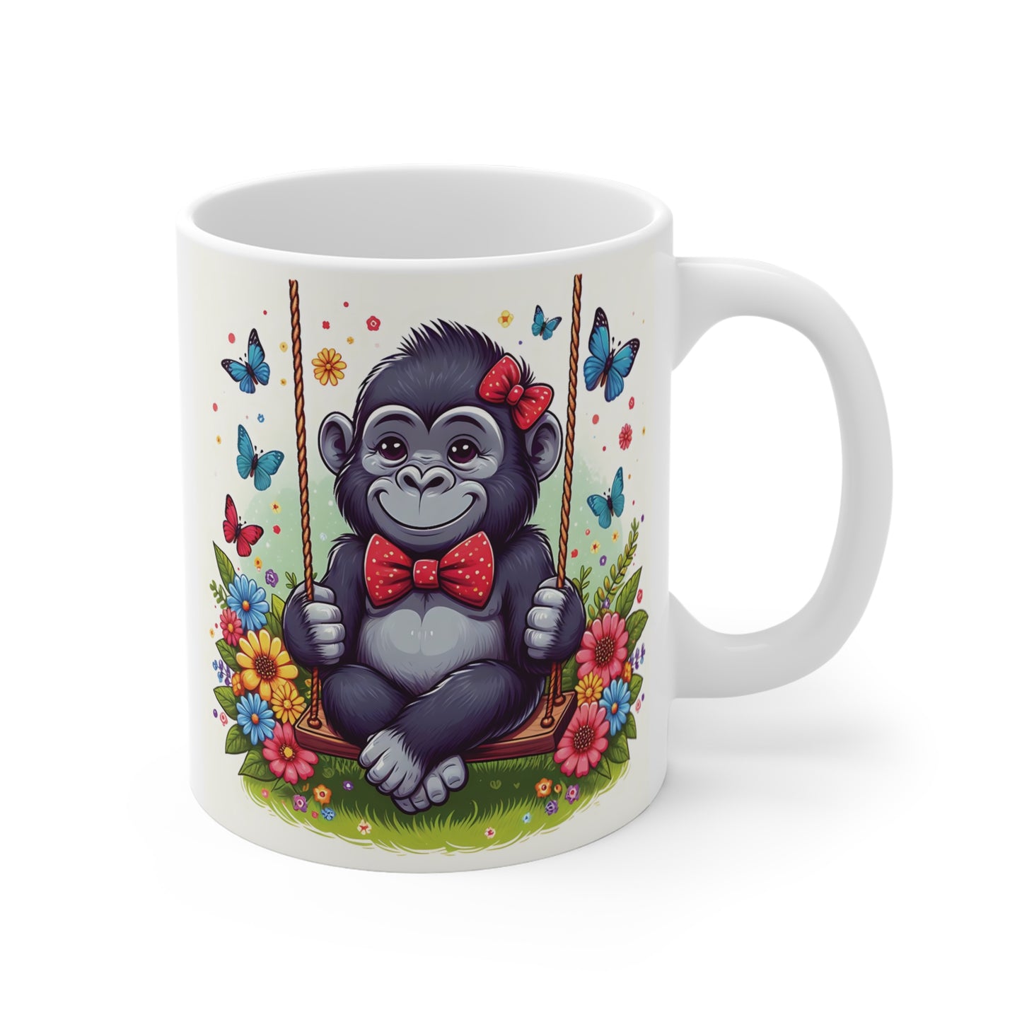 White ceramic mug featuring a cute baby gorilla sitting on a swing surrounded by colorful flowers and butterflies.