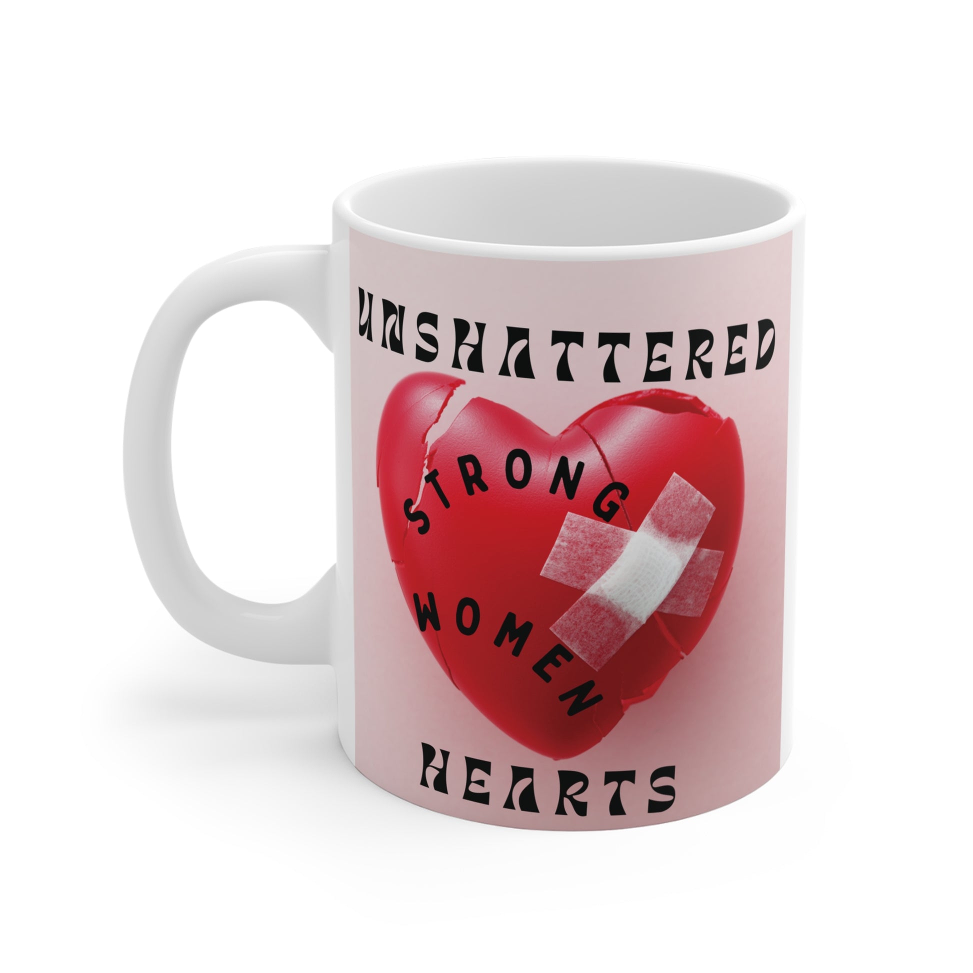 Inspirational gift mug for women featuring a mended broken heart design with a bandage and the quote "Unshattered Strong Women Hearts." Ideal for empowerment, healing, and mental health awareness gifts.