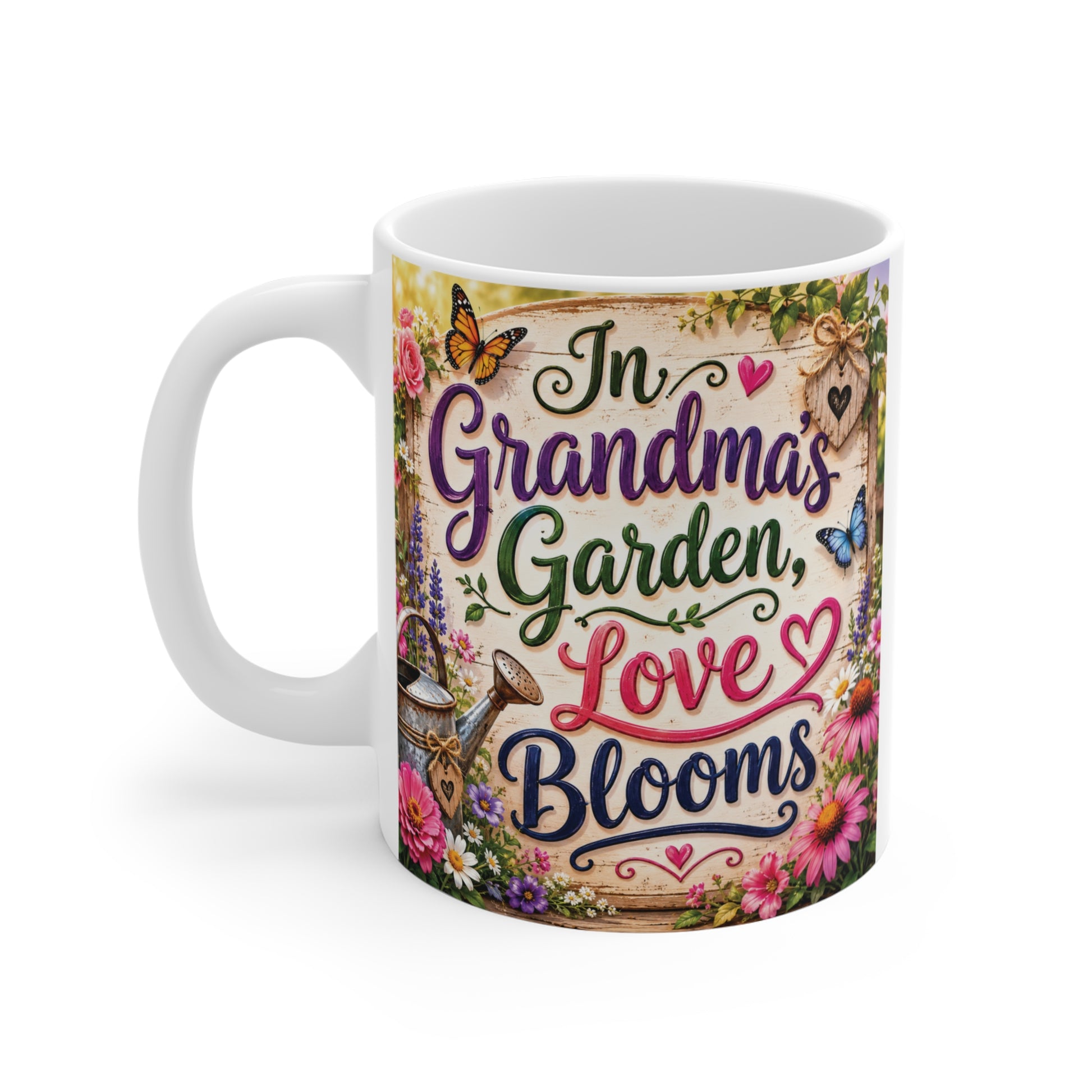 Ceramic Grandma mug decorated with flowers and butterflies displaying "In Grandma's Garden Love Blooms" message on a vintage-style background.