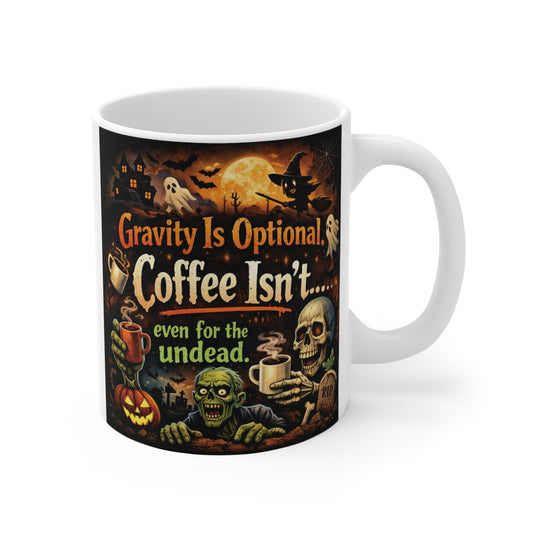White 11oz ceramic coffee mug featuring a spooky Halloween design with text reading "Gravity Is Optional, Coffee Isn't... even for the undead."