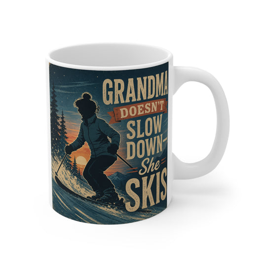 Vintage ski grandma coffee mug with the quote "Grandma Doesn't Slow Down She Skis" featuring a skier in a mountain landscape.