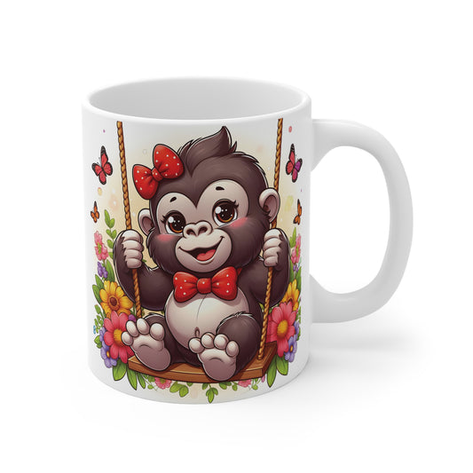 Cute baby gorilla swinging on floral swing with red bow and butterflies on white ceramic mug – adorable animal coffee cup gift
