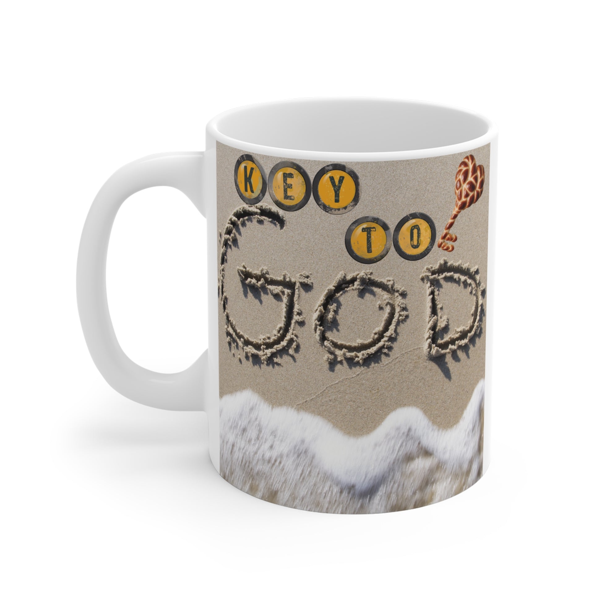 Christian mug with “Key to God” message written in sand, ocean waves, and seashell design