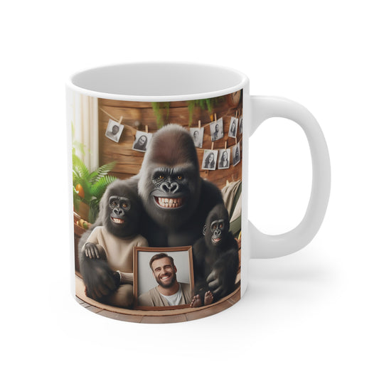 gorilla family mug featuring smiling gorillas holding a framed portrait photo in a cozy home setting, printed on a white ceramic coffee mug.