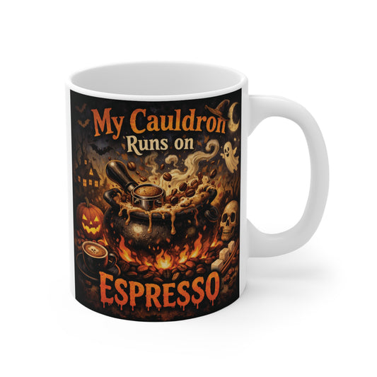 11oz ceramic coffee mug featuring the phrase "My Cauldron Runs on Espresso" with a spooky Halloween cauldron, pumpkins, skulls, bats, and magical coffee-themed artwork in vintage gothic style.