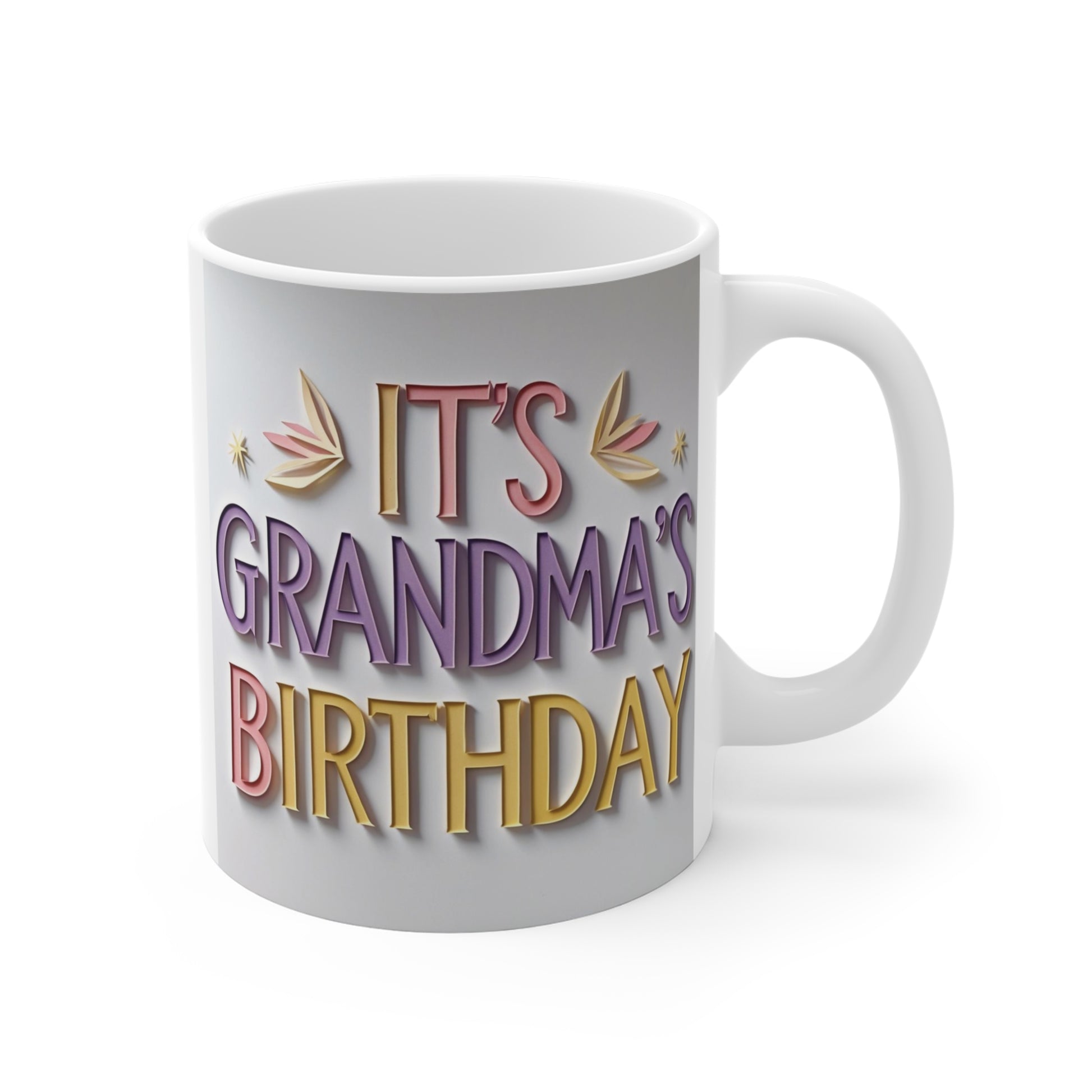 Colorful “It’s Grandma’s Birthday” 11oz ceramic coffee mug with pastel lettering and festive birthday design on white mug.