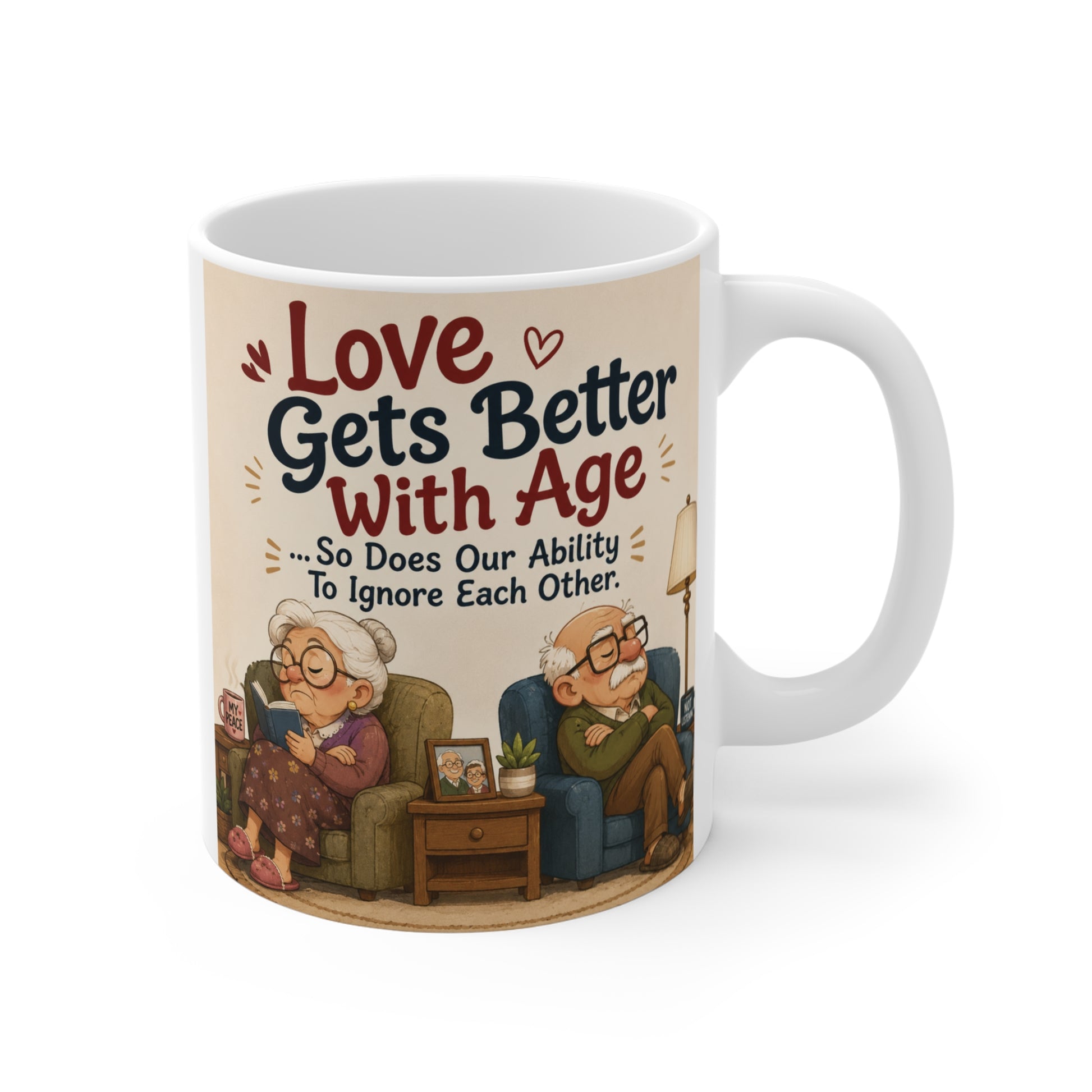 Funny 11oz ceramic mug featuring the quote "Love Gets Better With Age... So Does Our Ability To Ignore Each Other" with a cute cartoon elderly couple sitting in separate chairs, perfect for anniversary and retirement gifts.
