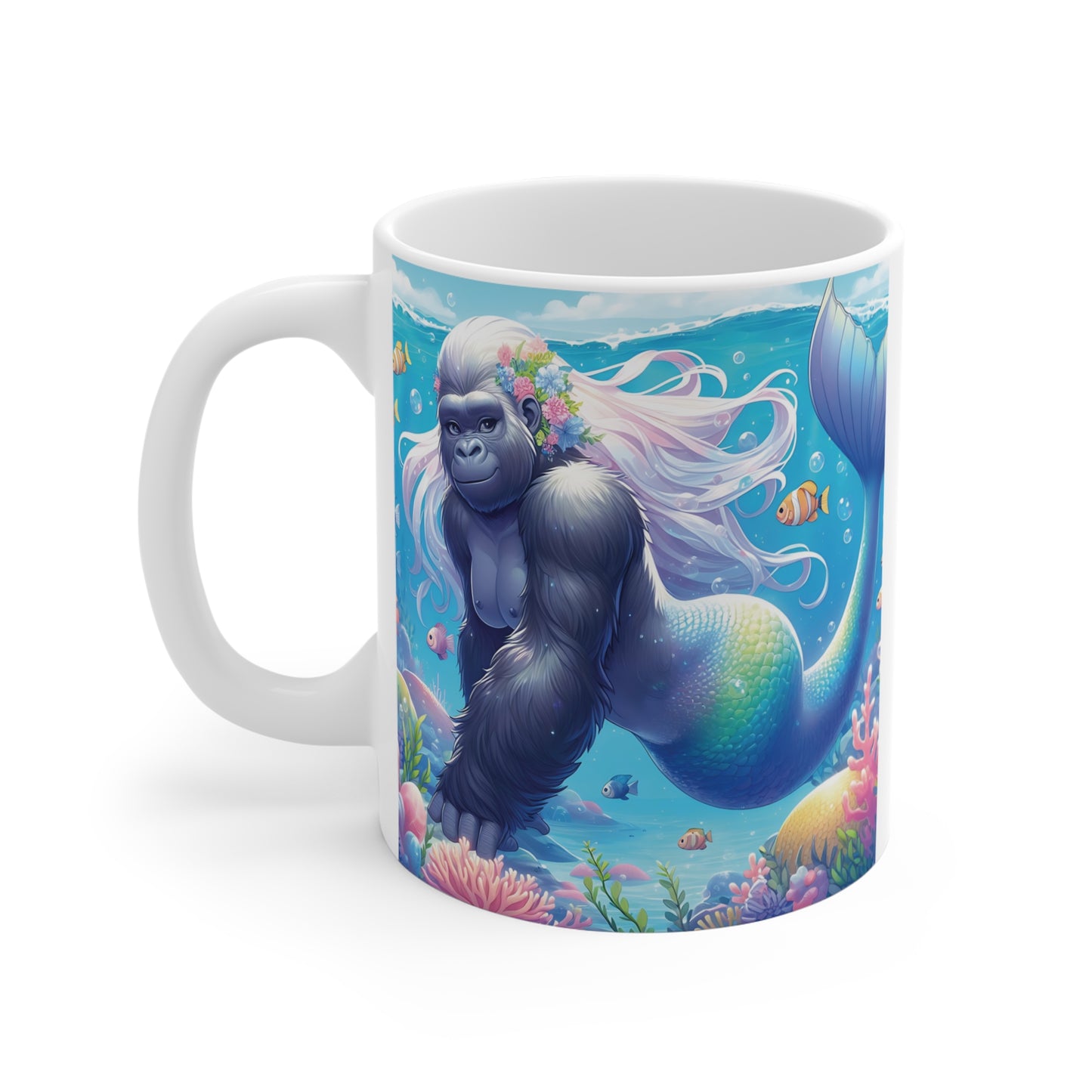 Whimsical gorilla mermaid illustration on a white ceramic mug, showing a flower-crowned gorilla with a colorful mermaid tail in a vibrant ocean reef environment.
