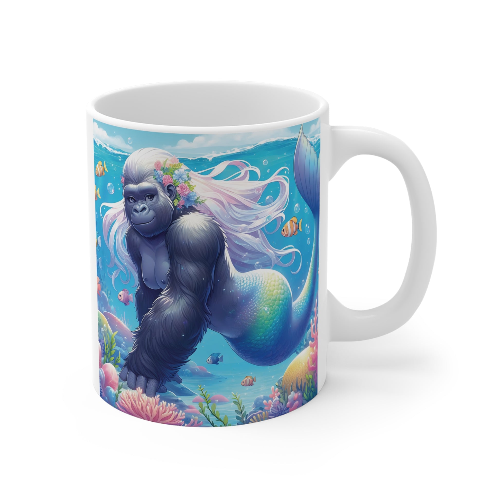 Fantasy gorilla mermaid with flowing white hair and flower crown swimming in a colorful coral reef, printed on a ceramic coffee mug with tropical fish and ocean scenery.