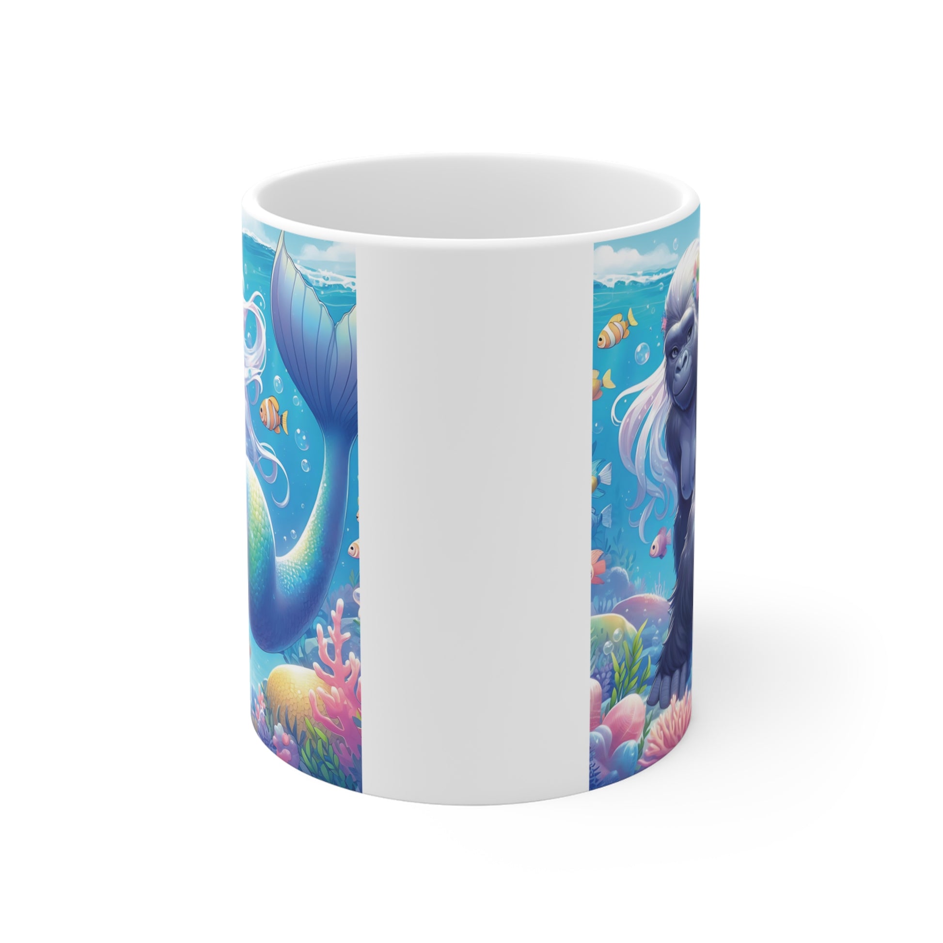 Ceramic mug featuring a gorilla mermaid with a shimmering fish tail, floral headpiece, and flowing hair surrounded by coral, bubbles, and tropical fish underwater.