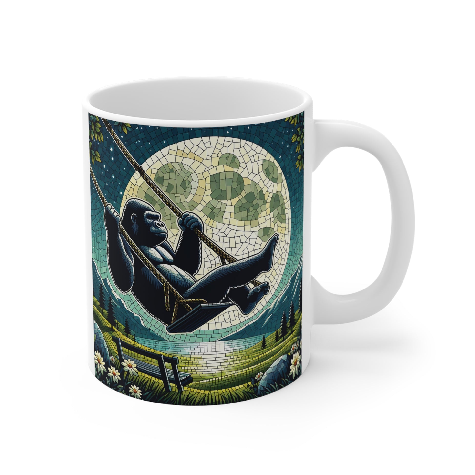 White ceramic mug featuring a gorilla relaxing on a swing beneath a large full moon in a stained glass style landscape