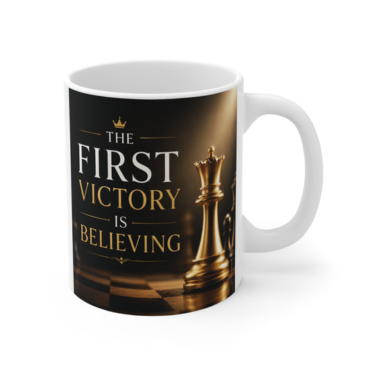 11oz motivational coffee mug featuring a gold chess king and the inspirational quote "The First Victory Is Believing" on a dark elegant background.