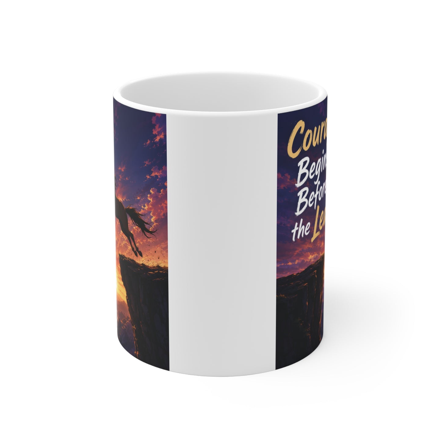 Ceramic motivational mug with horse jumping over a cliff during sunset, displaying an encouraging courage quote for daily inspiration.