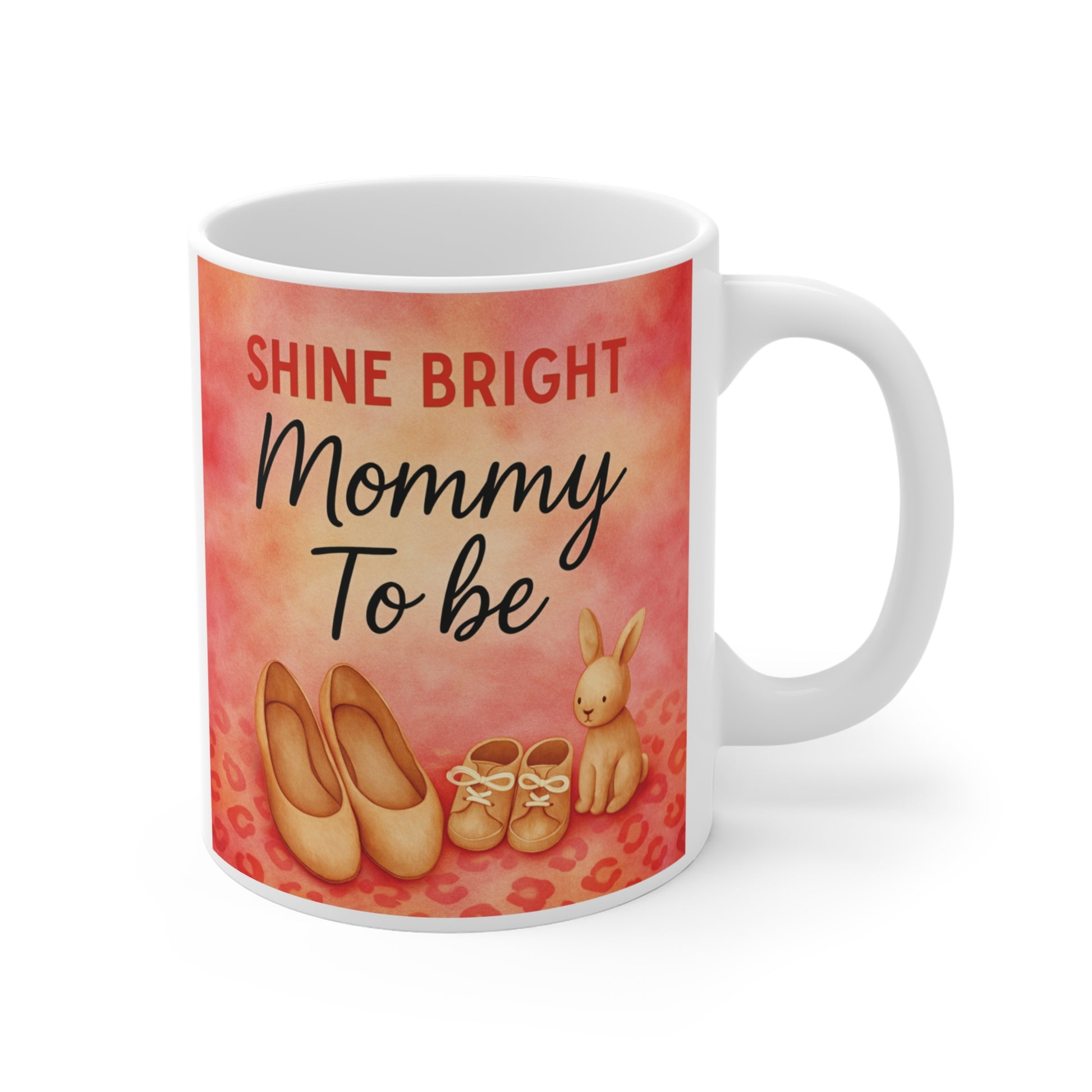 Shine Bright Mommy To Be mug with baby shoes, bunny illustration and warm pastel background, cute pregnancy mug gift for expecting mom