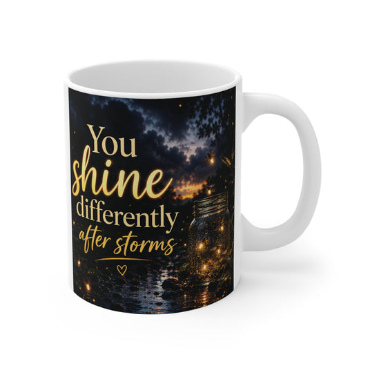 Inspirational 11oz mug with quote “You Shine Differently After Storms” and glowing night sky background