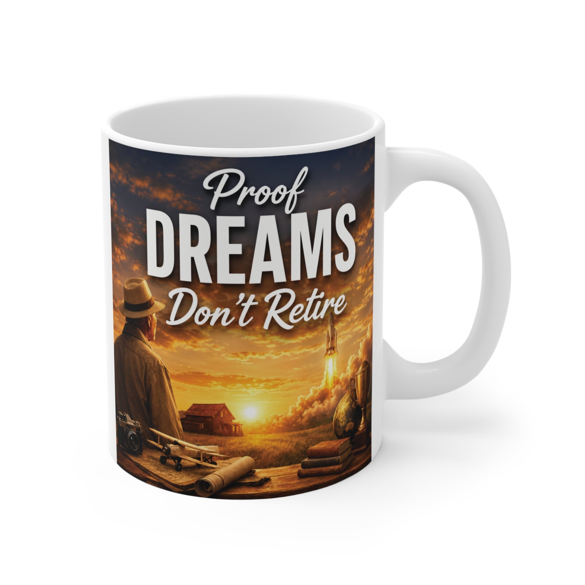 Inspirational 11oz ceramic retirement mug featuring the quote "Proof Dreams Don't Retire" with a rocket launch at sunset, symbolizing new beginnings and lifelong dreams.