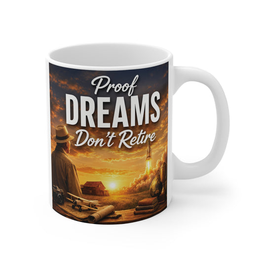 Inspirational 11oz ceramic retirement mug featuring the quote "Proof Dreams Don't Retire" with a rocket launch at sunset, symbolizing new beginnings and lifelong dreams.