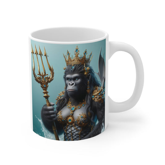 White ceramic mug featuring a regal gorilla mermaid queen wearing a jeweled crown and holding a golden trident in an ocean-inspired fantasy scene.