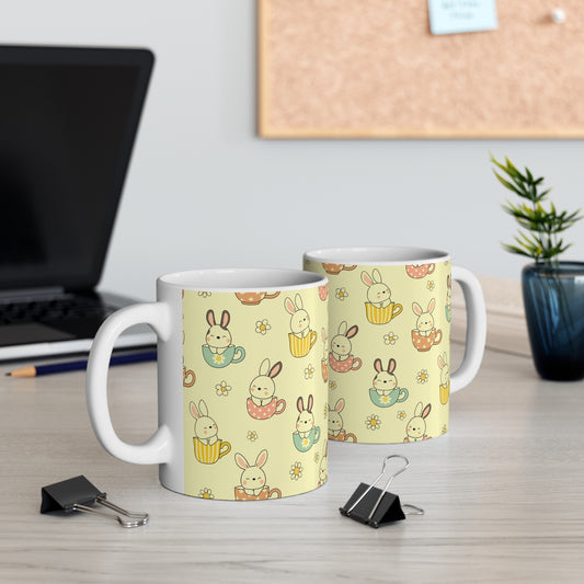 Cute bunny wrap around mug pattern with rabbits sitting in teacups, pastel colors and daisy flowers seamless design