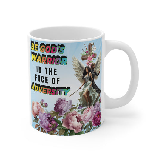 Christian inspirational mug with “Be God’s Warrior in the Face of Adversity” quote, angel figures, cross, and floral design