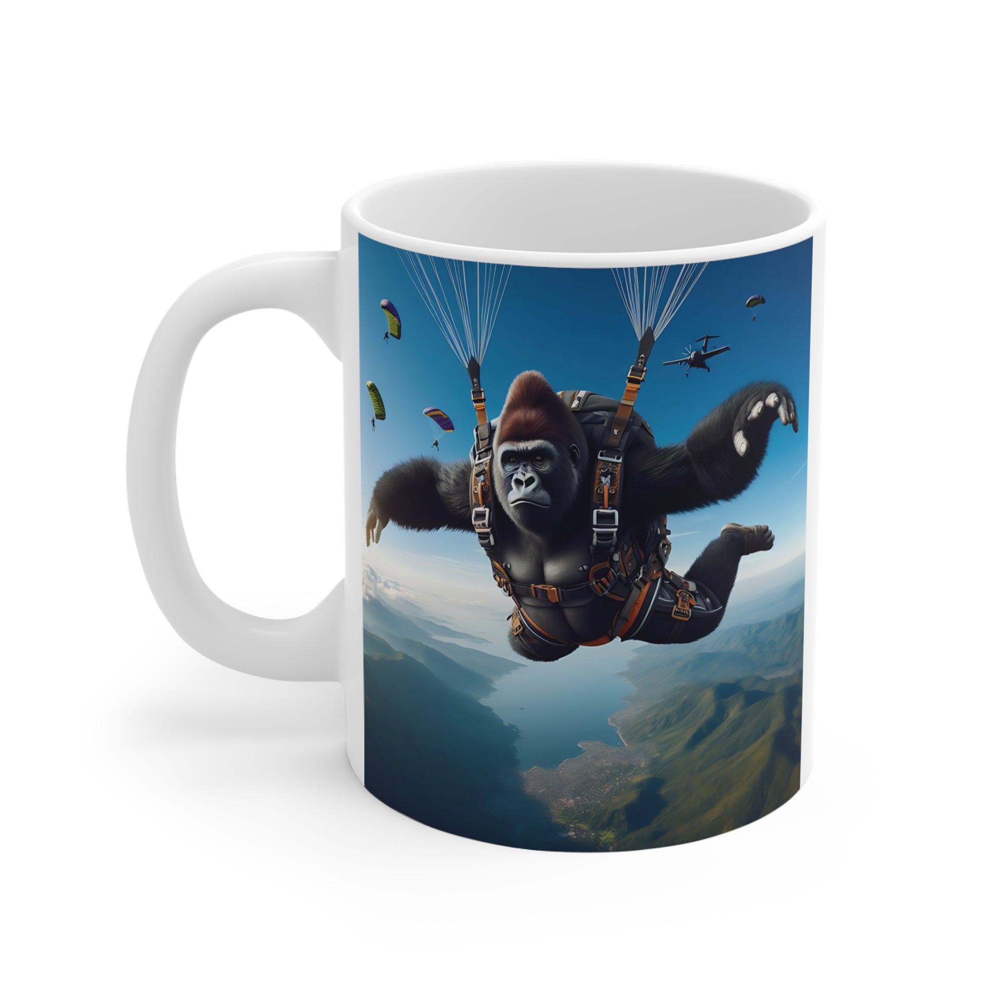 Unique parachuting gorilla mug design showing a fearless ape skydiver above a canyon and river, perfect novelty ceramic mug gift for outdoor adventure fans