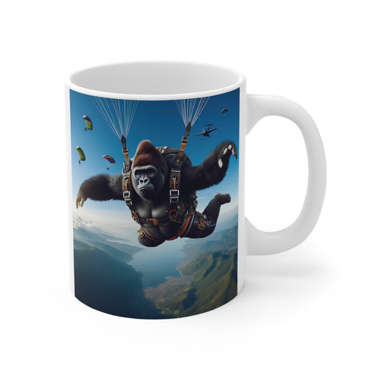 Funny gorilla skydiving mug featuring a parachuting ape flying over mountains and a lake on an 11oz ceramic coffee mug
