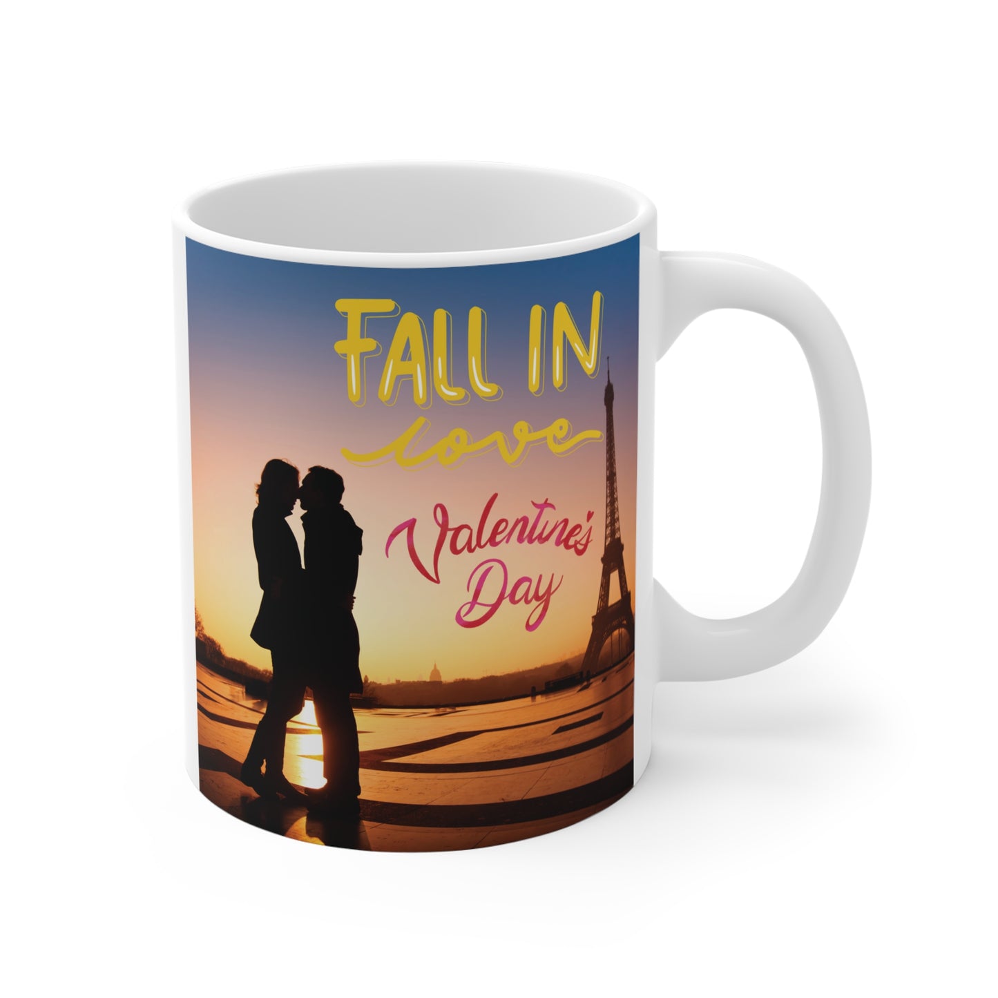 White ceramic Valentine's Day coffee mug featuring a silhouette of a couple in Paris with the Eiffel Tower and the text "Fall in Love Valentine's Day."