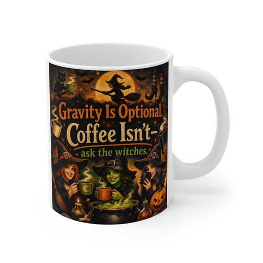 Gravity Is Optional Coffee Isn't Ask the Witches funny Halloween witch coffee mug featuring three witches around a bubbling cauldron with vintage spooky artwork on an 11oz ceramic mug.