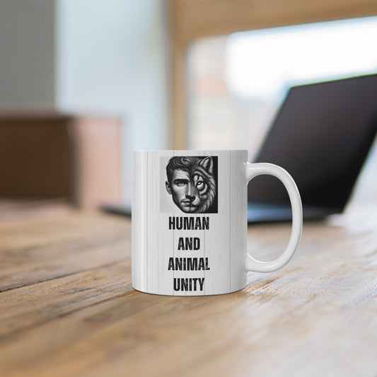 White ceramic coffee mug featuring a black and white graphic of a split face, half human man and half tiger, with the vertical text "HUMAN AND ANIMAL UNITY" in a distressed stencil font.