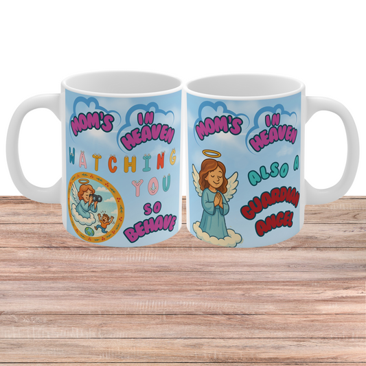 white ceramic mug featuring a "Mom’s In Heaven" design with cartoon illustrations of a guardian angel, fluffy clouds, and playful colorful text reading "Watching You So Behave.